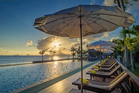 Outdoor pool, open 7:00 AM to 7:00 PM, pool umbrellas, sun loungers