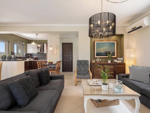 Family Villa, 3 Bedrooms, Sea View | Living area | 55-inch Smart TV with satellite channels, fireplace