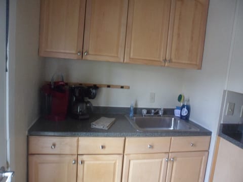 sink and 2 different coffee makers