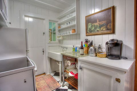 Modern range, refrigerator and Keurig coffee maker in the kitchen