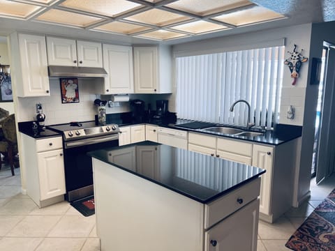 Kitchen with window overlooking pool/harbor