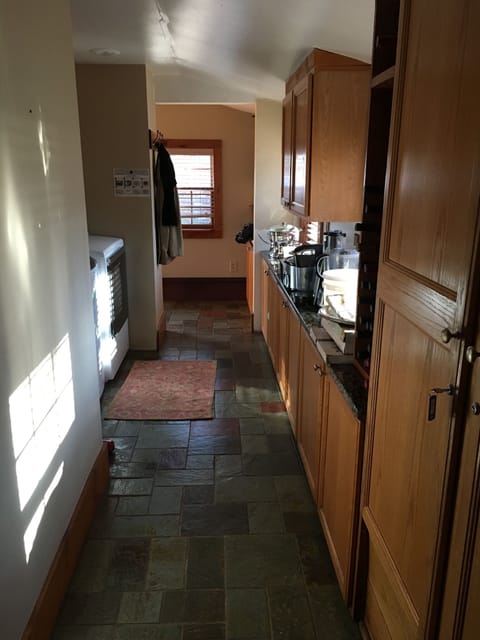 Downstairs hallway with laundry.