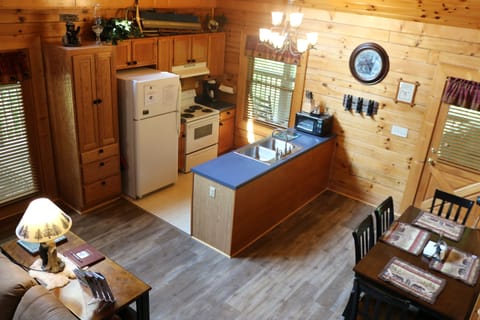 View of kitchen and dining table from loft