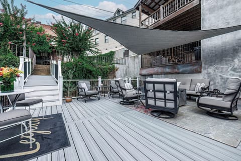 Spacious patio!   Shows 10 steps down from parking to the patio & loft door. 