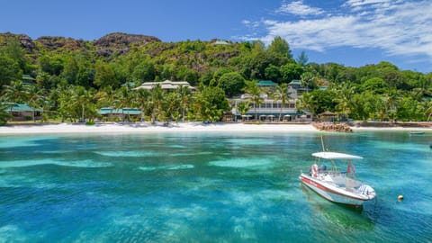 On the beach, white sand, sun loungers, beach towels