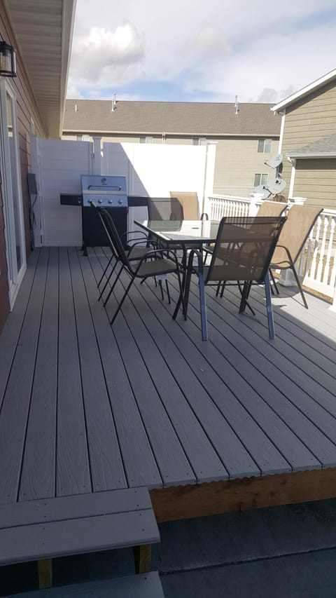 deck with table and  barbecuer