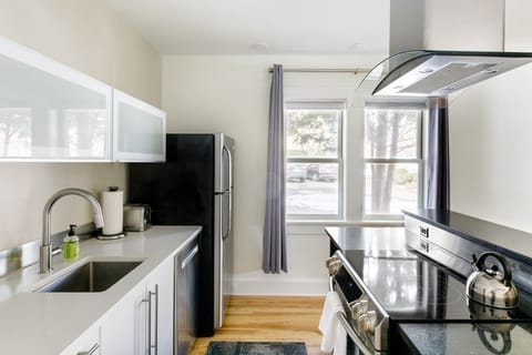 Cook, sip, or snack in a high-end Ikea kitchen—fully equipped for all your culinary needs.