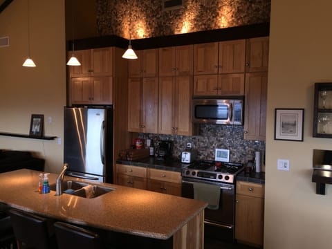 Modern Kitchen, opens up to deck with french doors to BBQ.  Easy seating for 16.