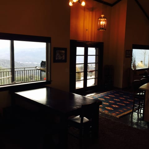 Large custom wood wrapped picture windows with expansive 180 degree views.