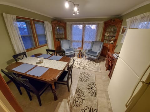 First Floor - Sun room with Kitchen Table, Desk & Reading Nook.