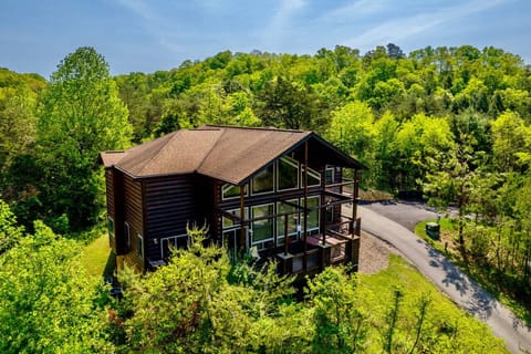 The exterior of Mountains, Movies & More, a large luxury 3 bedroom cabin.