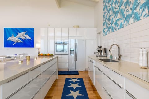 High end kitchen with cooktop, oven, fridge freezer, dishwasher & espresso mach.