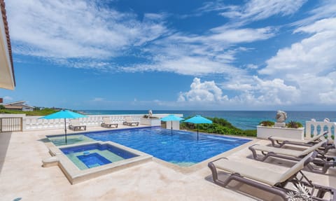 Large pool with hot tub, lounge chairs and umbrellas!
