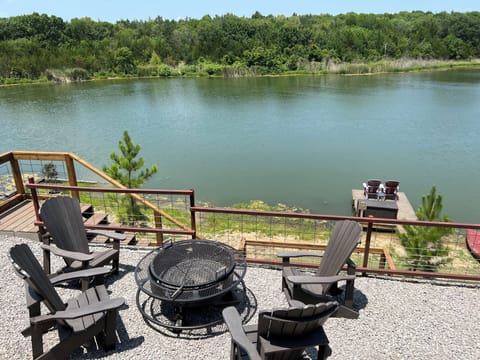 Amazing views from this three-story home on a 5 acre lake with Texoma views