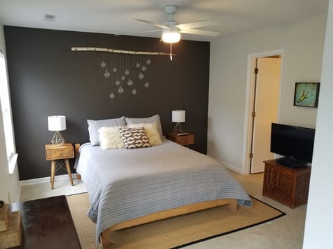 Primary - Queen Bed, Bathroom Ensuite, Walk-In Closet w/ Crib, 32” TV