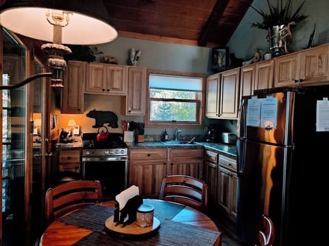 Fully equipped kitchen with gas stove and cookware for easy lakeside meals.