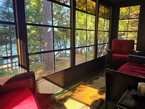Unwind in the sunroom with lake views and glowing northern skies.