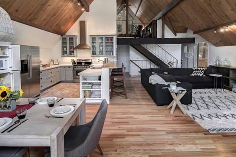 Great Room with stairs leading up to the loft rooms and down to the woodroom.