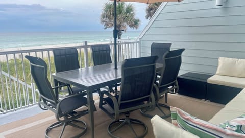 Large main balcony with sectional and dining table for 6. Direct views of ocean.