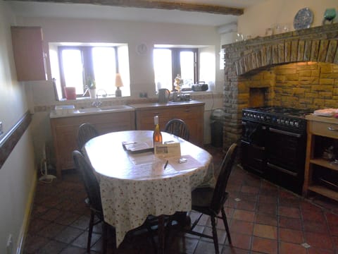 Farmhouse kitchen, with dual-fuel range. Extra chairs are also available.