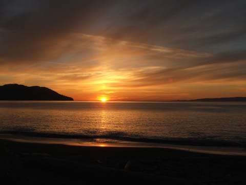 Gorgeous sunsets easily enjoyed right on the beach, just steps from the house.