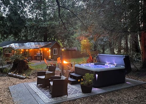 Private forest retreat with hot tub, fire pit, and cozy outdoor spaces