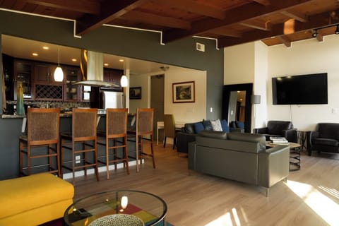 Living room looking at kitchen and TV