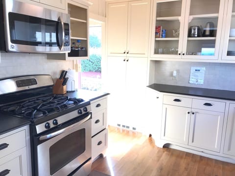 kitchen has stove, oven, microwave, dishwasher.