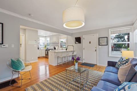 Open concept bright living room and kitchen. 