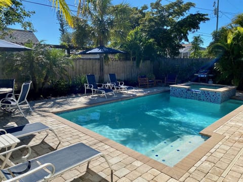 Constant Intense Sun Two Umbrellas, Outdoor Dining , 4 lounge chairs Weber grill