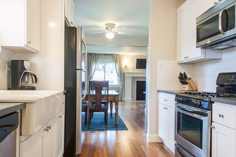 Galley kitchen leads to the dining and living rooms