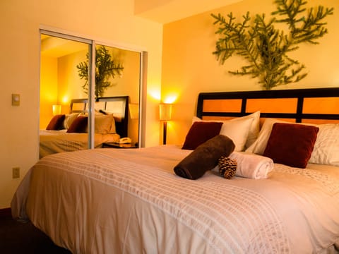 King-sized bed with pillow top mattress and 1,200 thread-count sheets