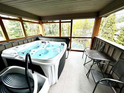 Hot tub off the bedroom, overlooking the outdoor pool