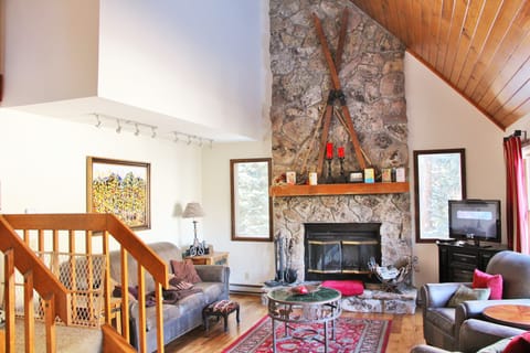 Entertain in the Great Room with it's soaring ceilings and Stone Fireplace