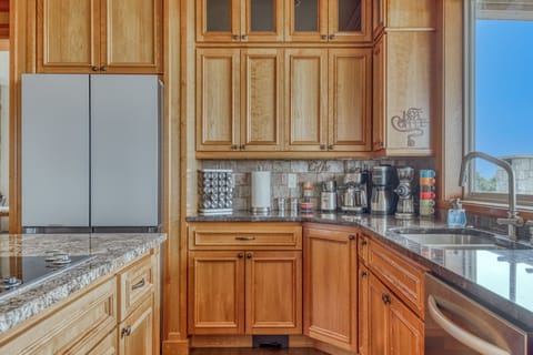 Kitchen has a large variety of high end appliances/supplies for making coffee