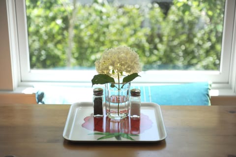 The dining area has lovely views of the garden and neighborhood.
