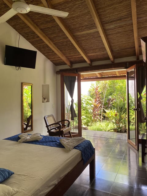 Room, 1 Queen Bed, Garden View (AC Extra Charge) | In-room safe, blackout drapes, iron/ironing board (on request)