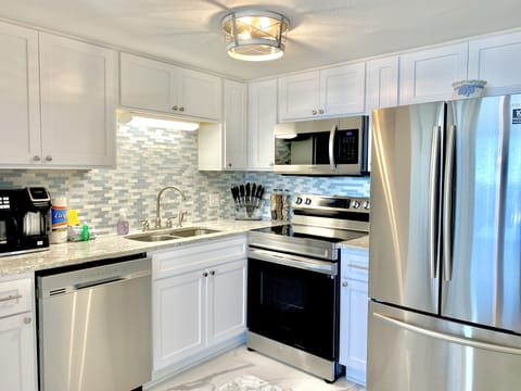 Condo, 2 Bedrooms, Balcony, Beachfront (202) | Private kitchen | Full-size fridge, microwave, oven, stovetop