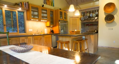 The kitchen in the main house offers an open layout and is well stocked