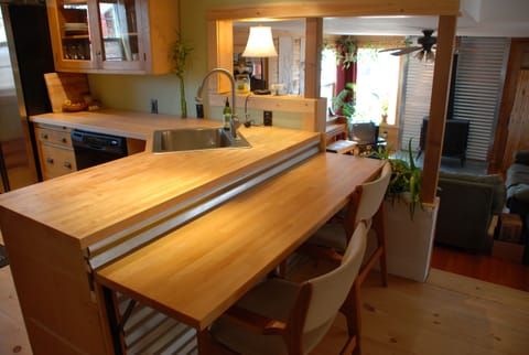 Two level snack counter for informal meals and food serving.