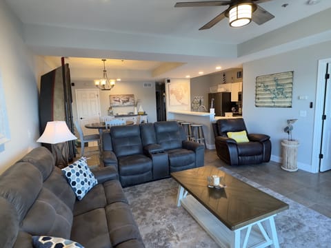 Main living room with plenty of seating with reclining sofa/loveseat & recliner.