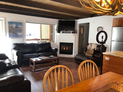 View of living room from dining area.  You can see the front door in the pic.