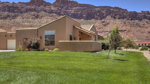 Welcome to Moab Magic Too 
3 bedroom/2 bath, 2 car garage and patio
