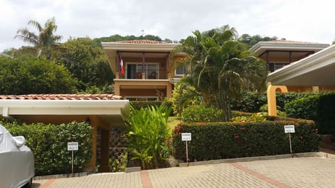 Partial front view of Villa and parking area. 