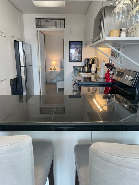 Kitchen and door leading to the bedroom.