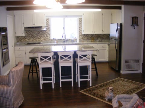 Well appointed kitchen with large center
island with seating for 6