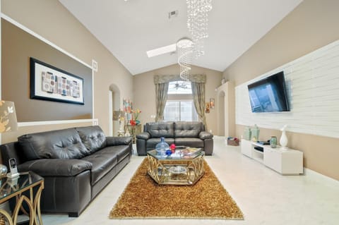 Living room area with a 65 inch led tv 