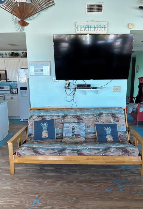 Large flat screen TV plus a futon that makes a double bed in the living room!