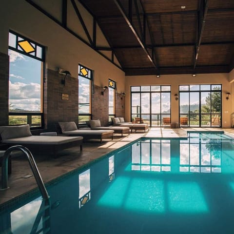 Indoor pool, outdoor pool, open 8 AM to 10:30 PM, pool umbrellas