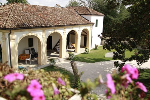 Barchessa shooting from the windows of Villa
